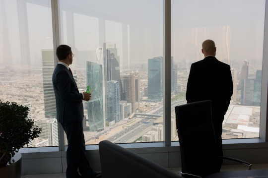 Noah and Justin survey Dubai from the PM's offices.